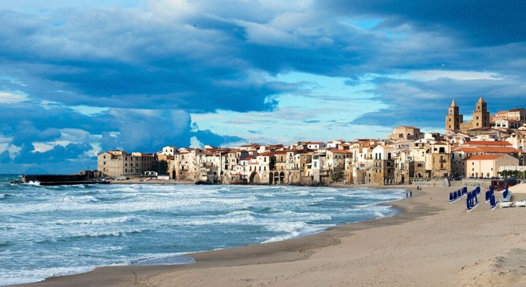 The beach and the houses of Cefalù, day excursion from Palermo